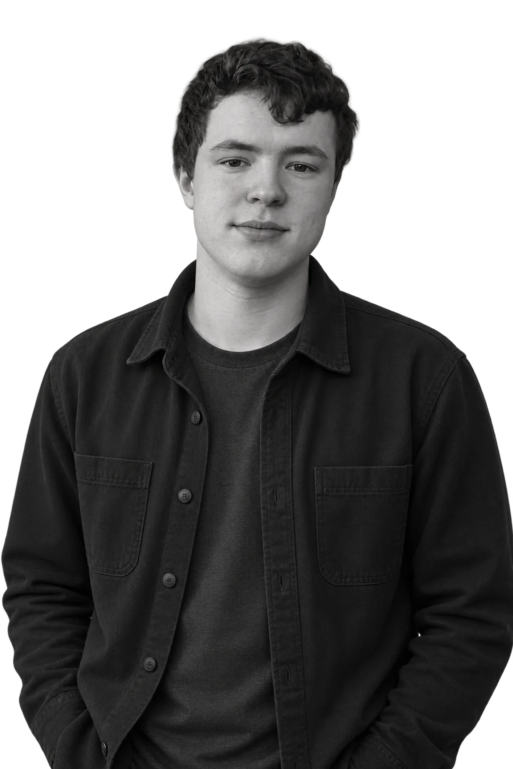 Oakley Jenke, a black and white portrait lit against a dark background.